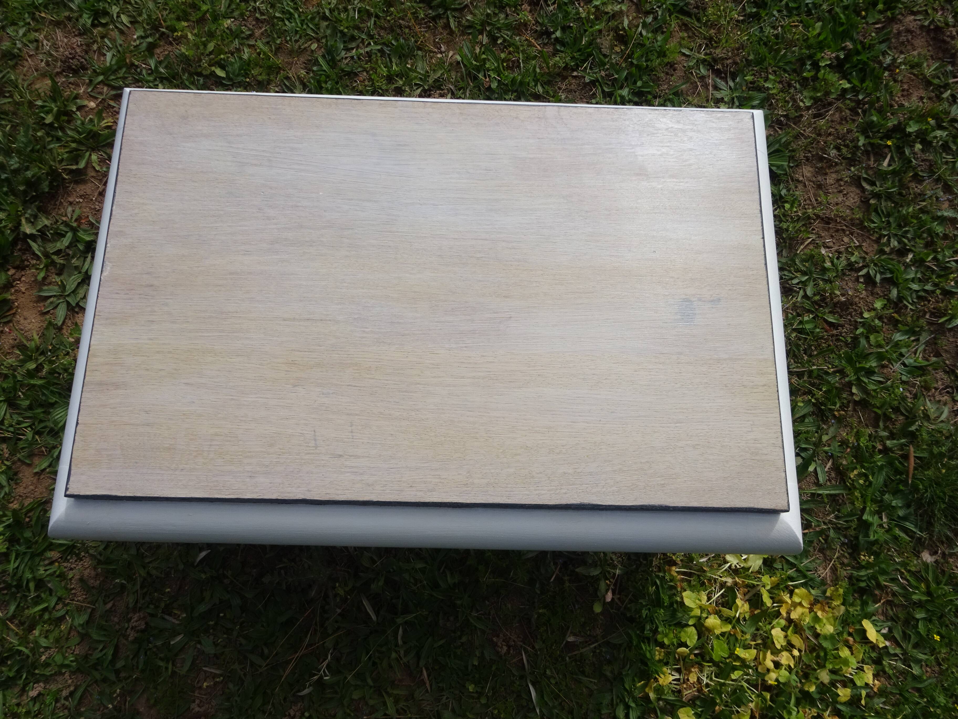 Oak coffee table with curved legs.