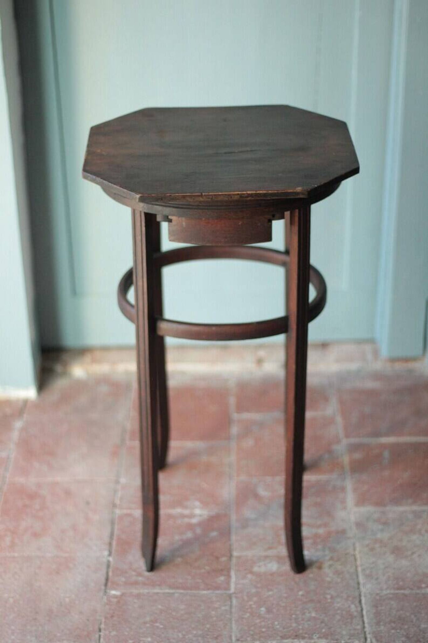 Wooden drawer table or 19th-century work table with a curved wooden stretcher, in the style of Thonet, circa 1900-1920.