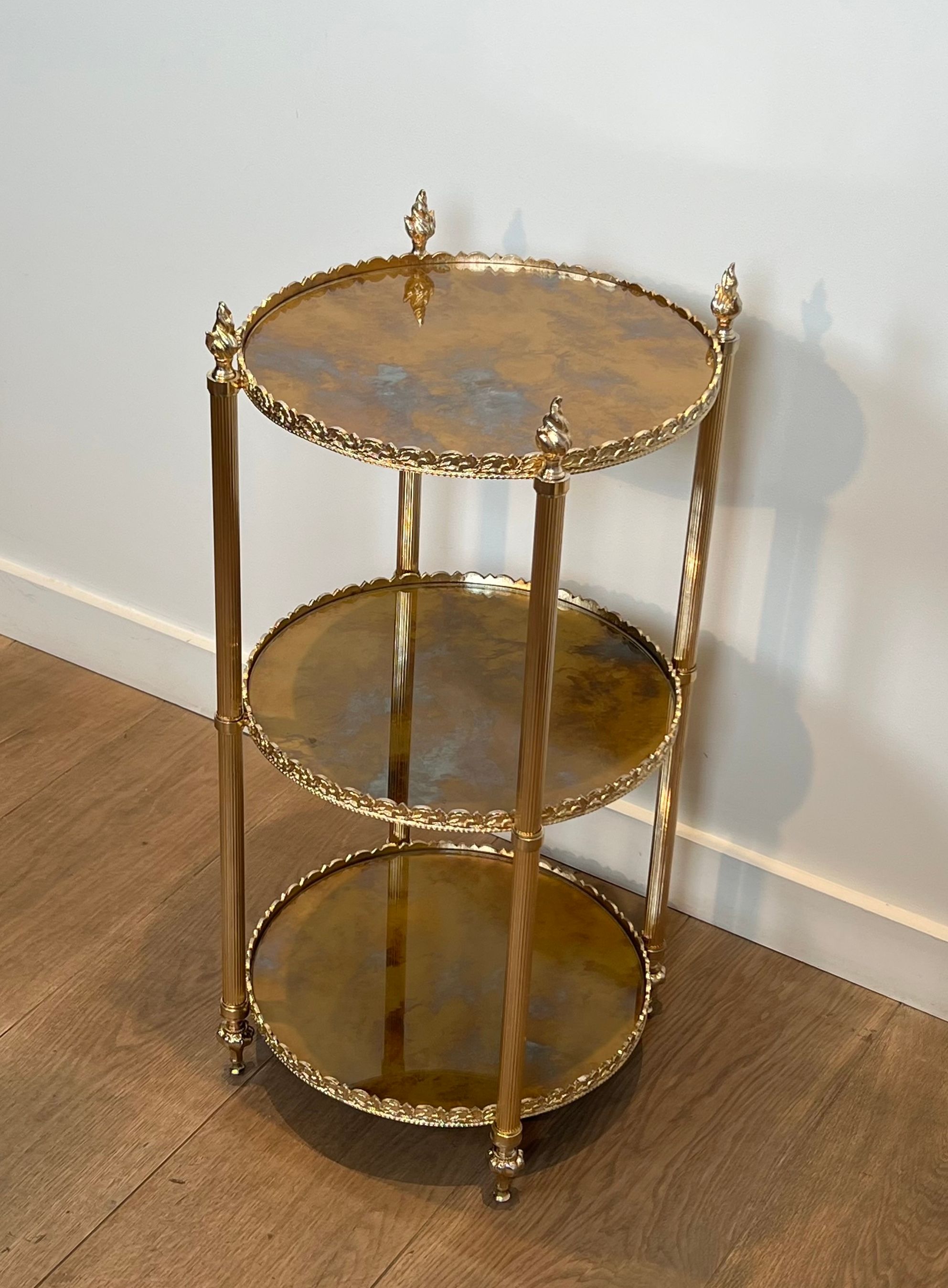 Round silver-plated brass table with triple eglomisé mirror tops from Maison Jansen.