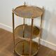 Round silver-plated brass table with triple eglomisé mirror tops from Maison Jansen.