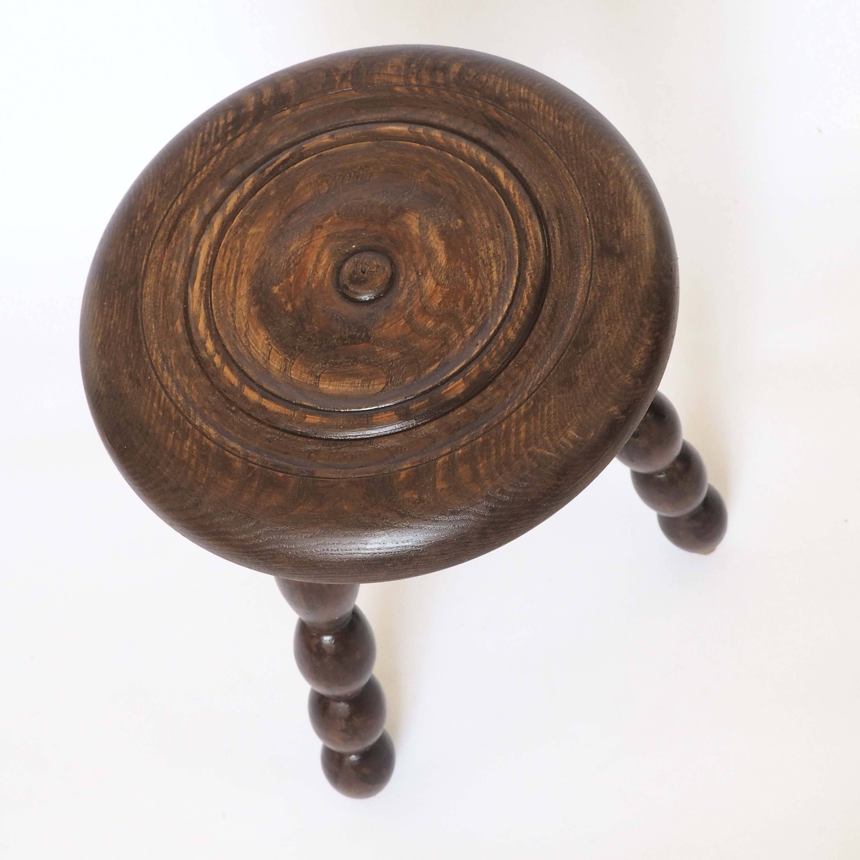 Beaded wooden tripod stool