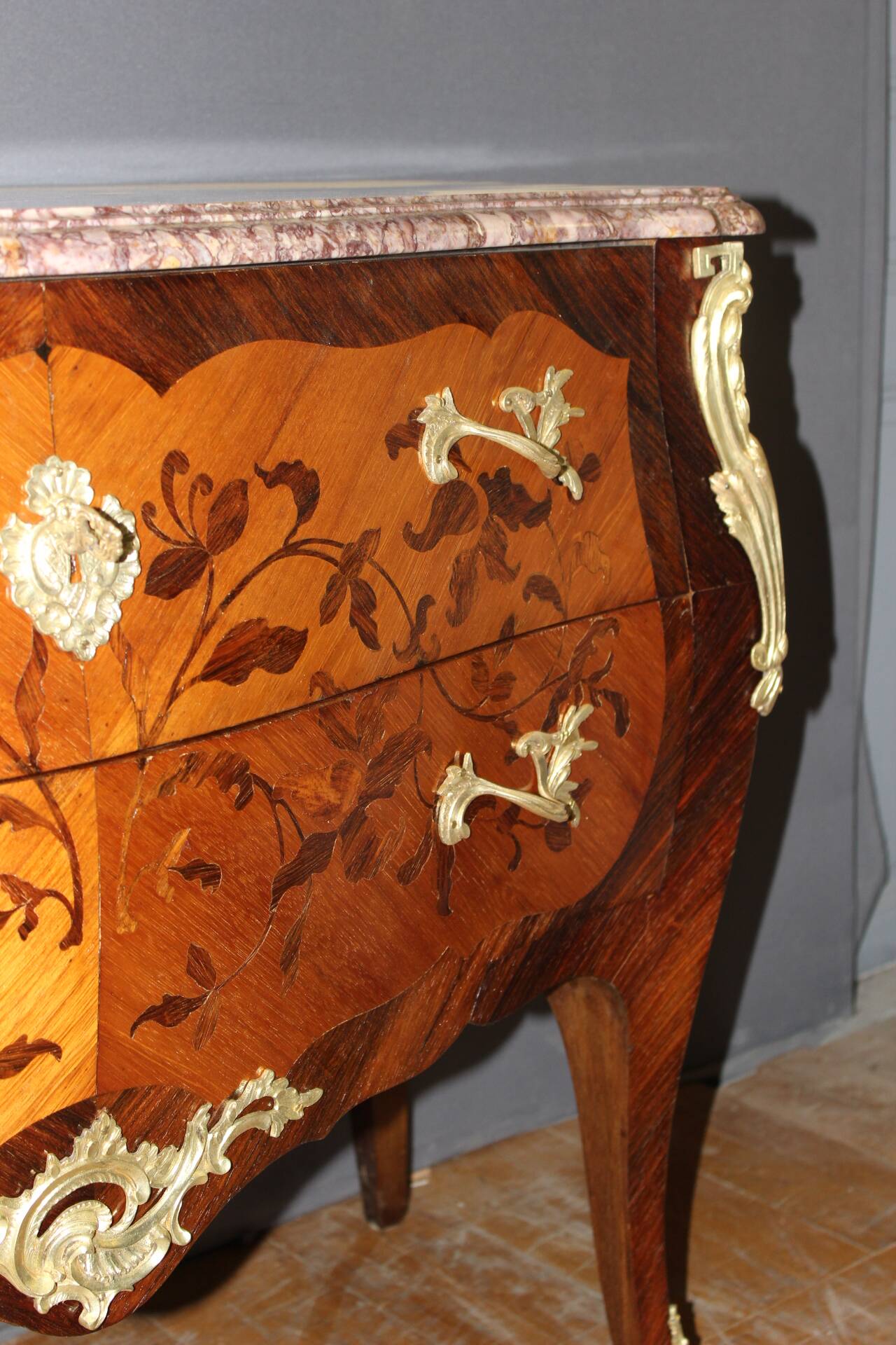 Louis XV style commode in marquetry from around 1930.