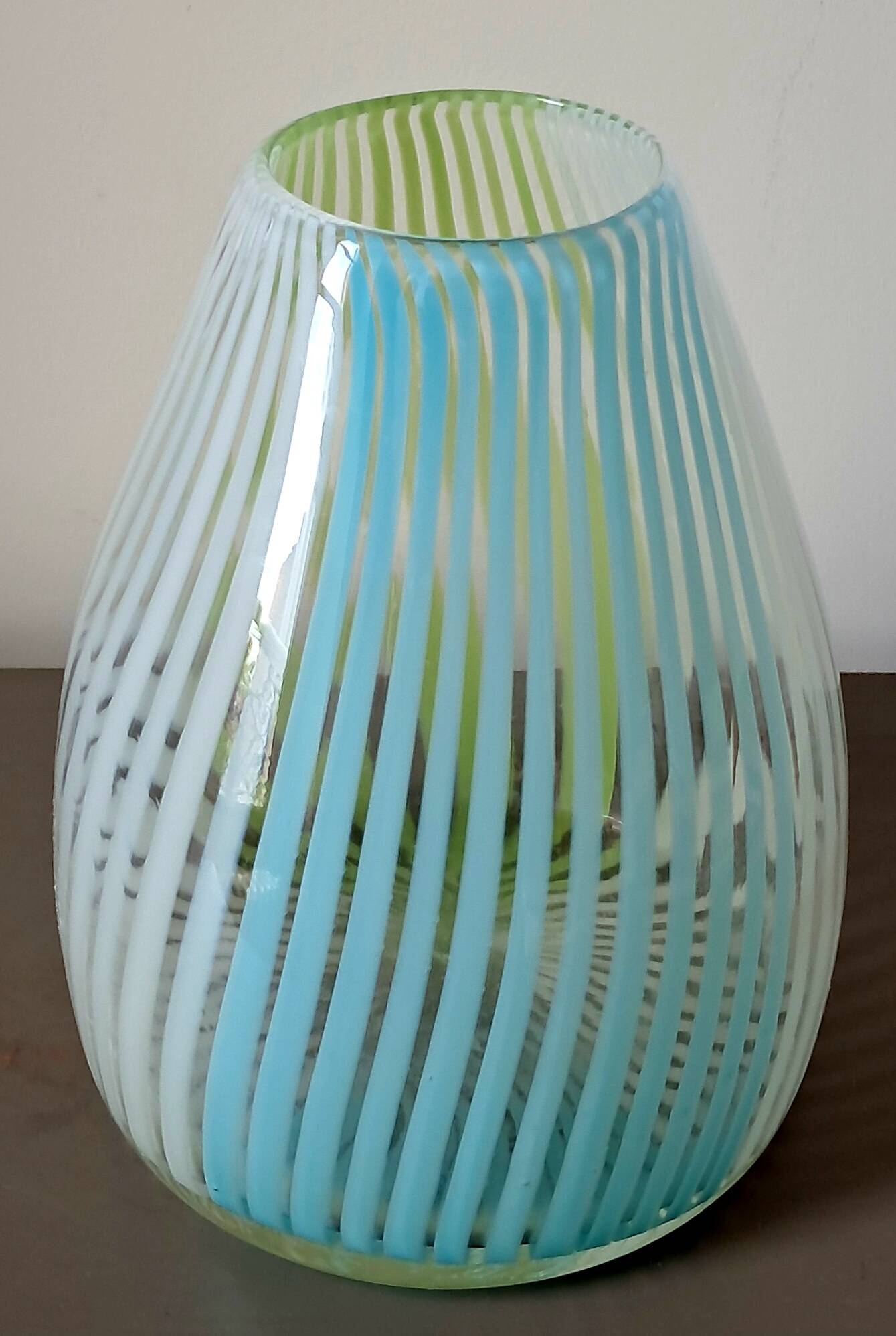 Blown glass vase with opal glass threads