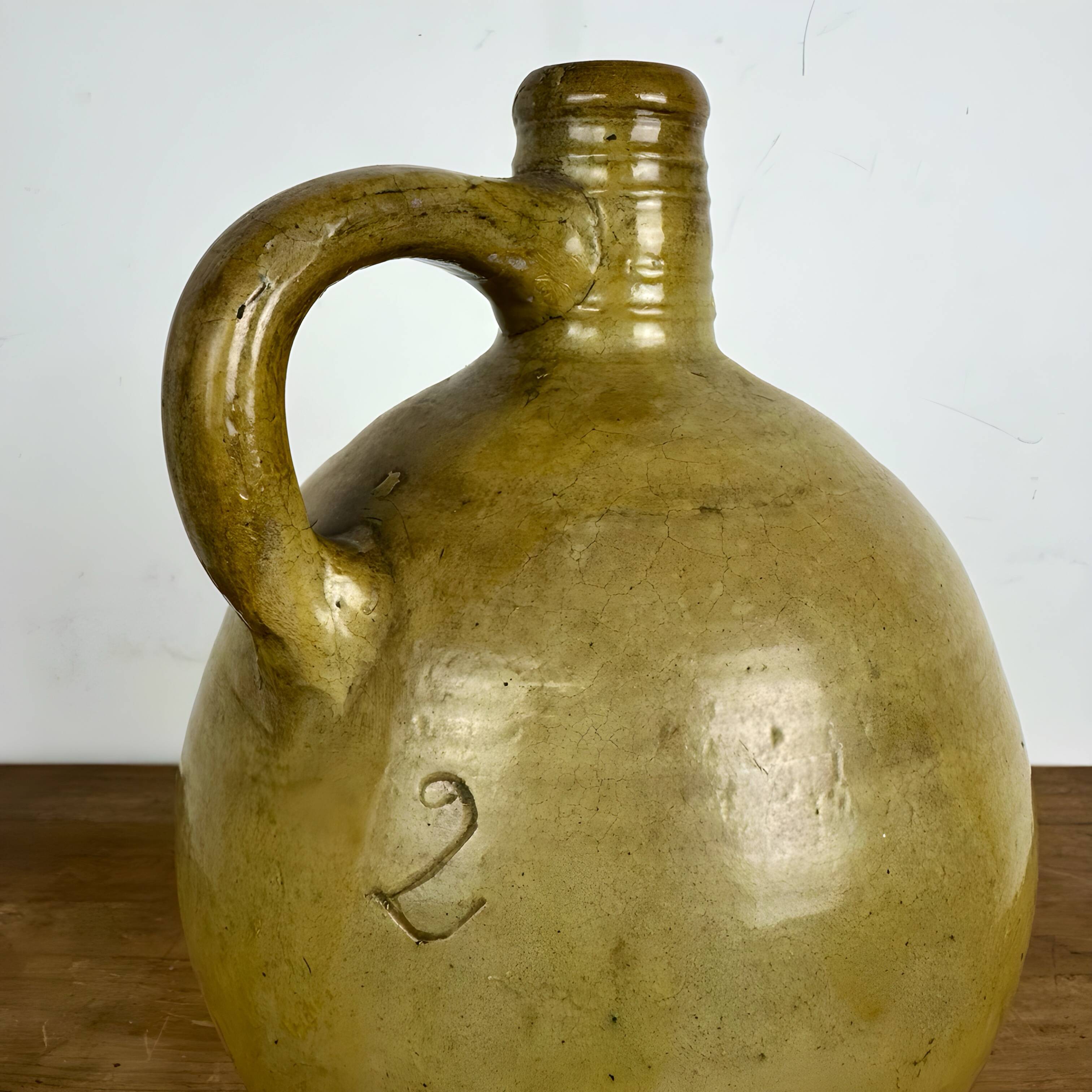 Antique glazed earthenware jug