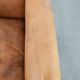 Vintage sheepskin armchair with a beautiful light colour and elegant legs