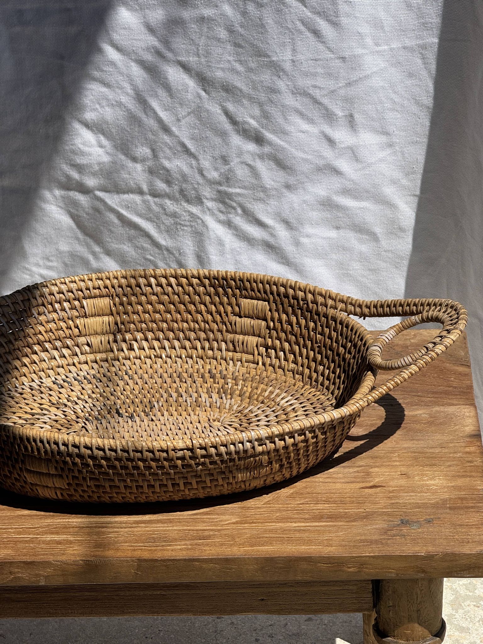 Large flat oval woven rattan basket with handles, Indonesian L53x64