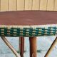Round wood and rattan table
