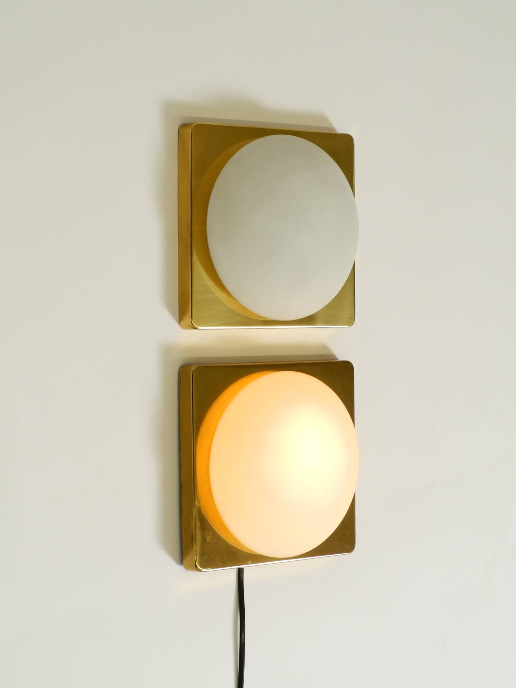 Two 1970s brass wall lamps by Rolf Krüger for Heinz Neuhaus Leuchten