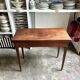 Folding table, dark wood console.