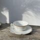 Pair of fine white and gold Limoges porcelain teacups