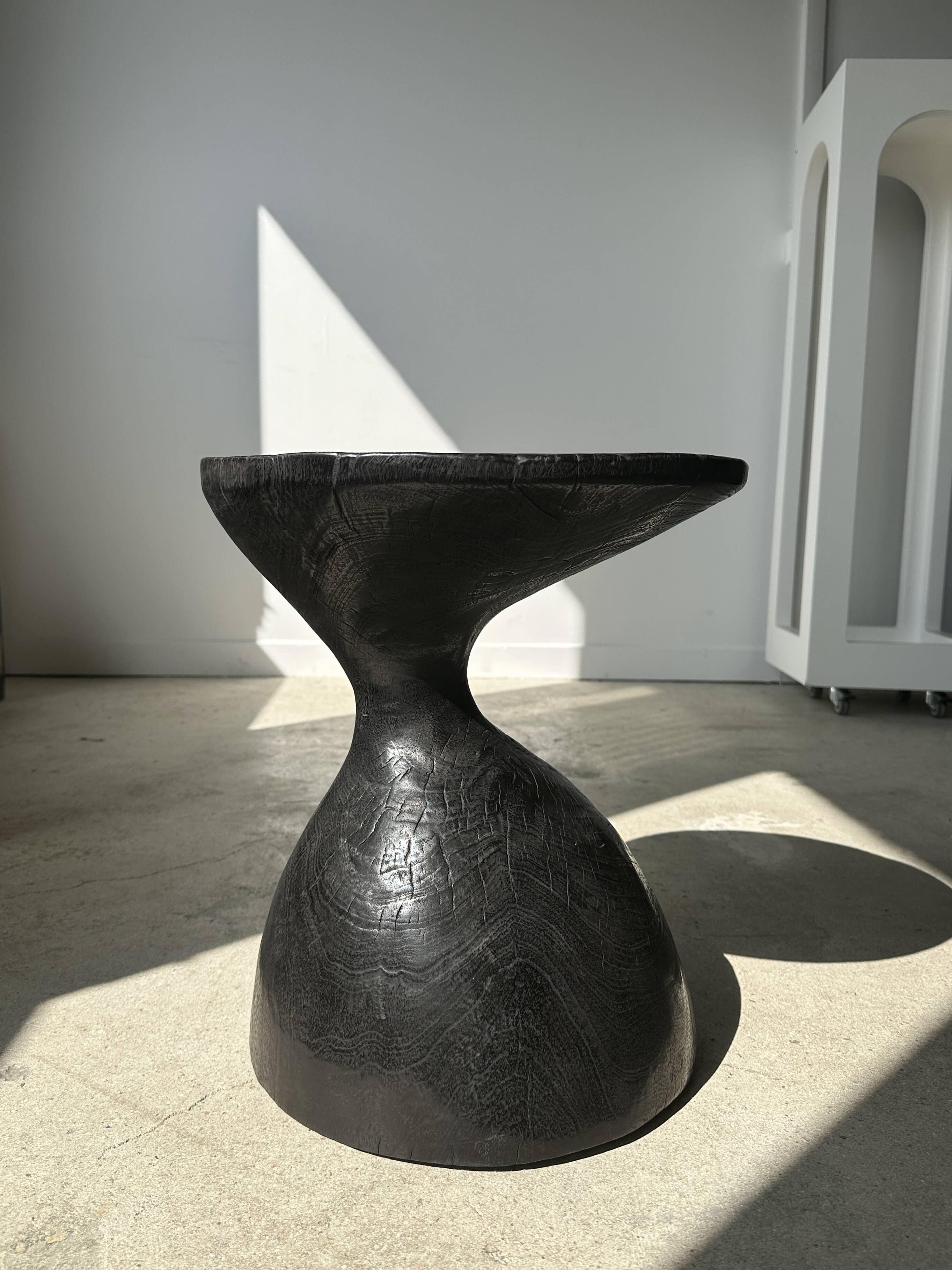 Solid wood (monoxyl) side table, organic shape, black color