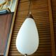 Goffredo Reggiani ovoid teak and opaline pendant light, 1950s