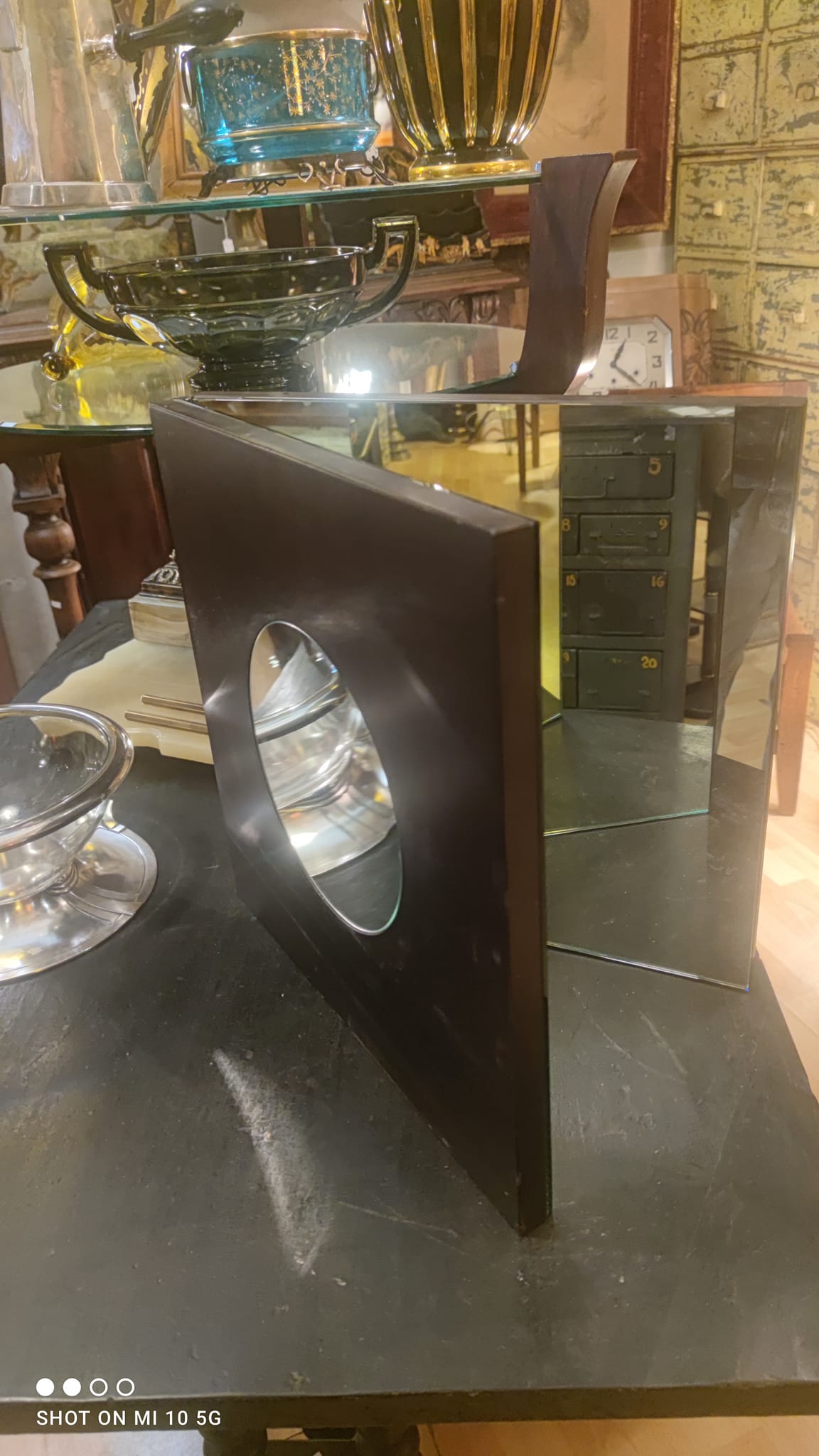 Wall mirror with a wooden frame and Wenge finish, dating from the late 19th century