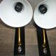 Pair of modernist sconces in black and gold metal