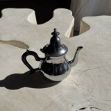 Silver-plated teapot with black handle