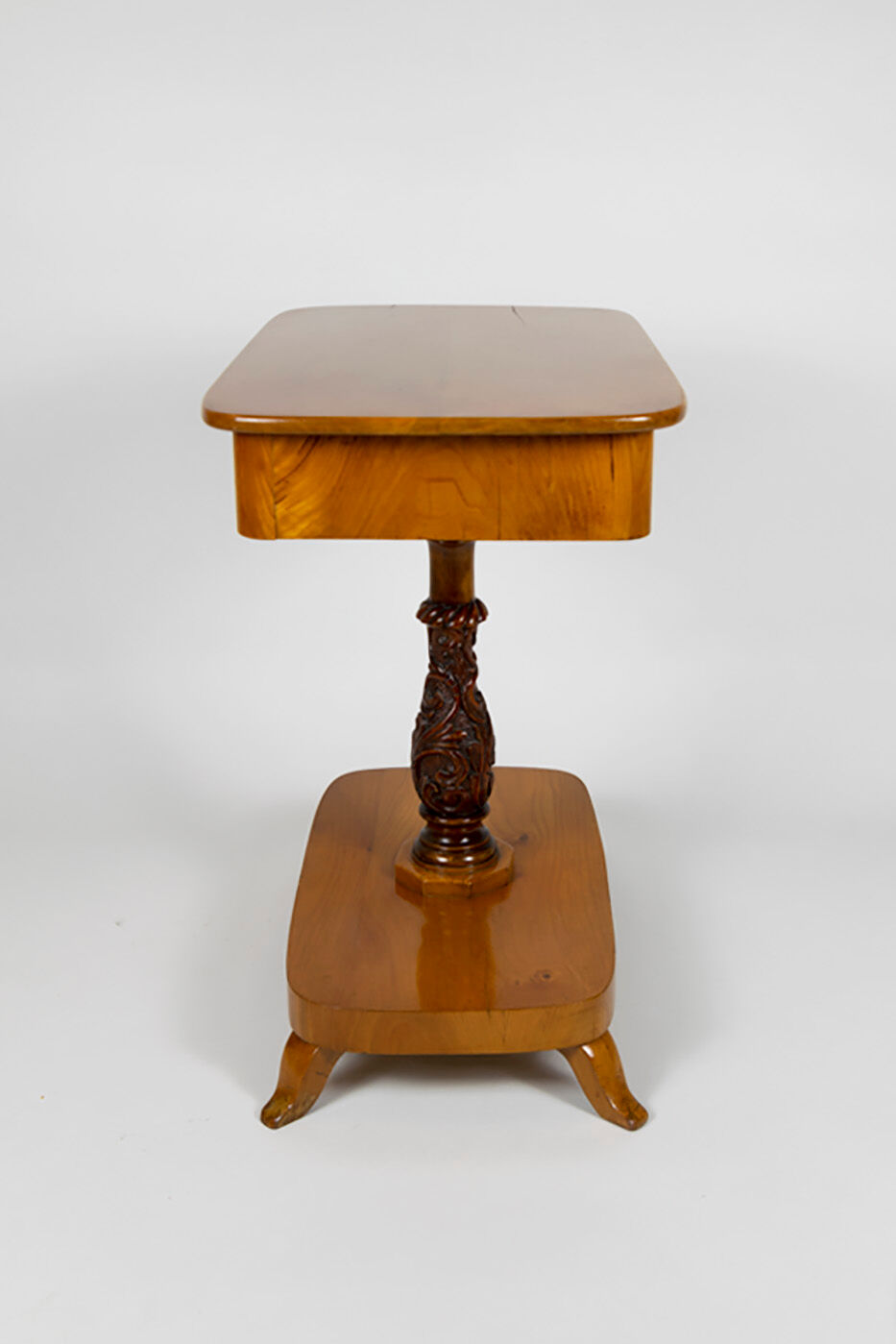 Danish Biedermeier elm occasional table with carved base and drawer