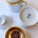 2 white and gold Limoges porcelain tea cups