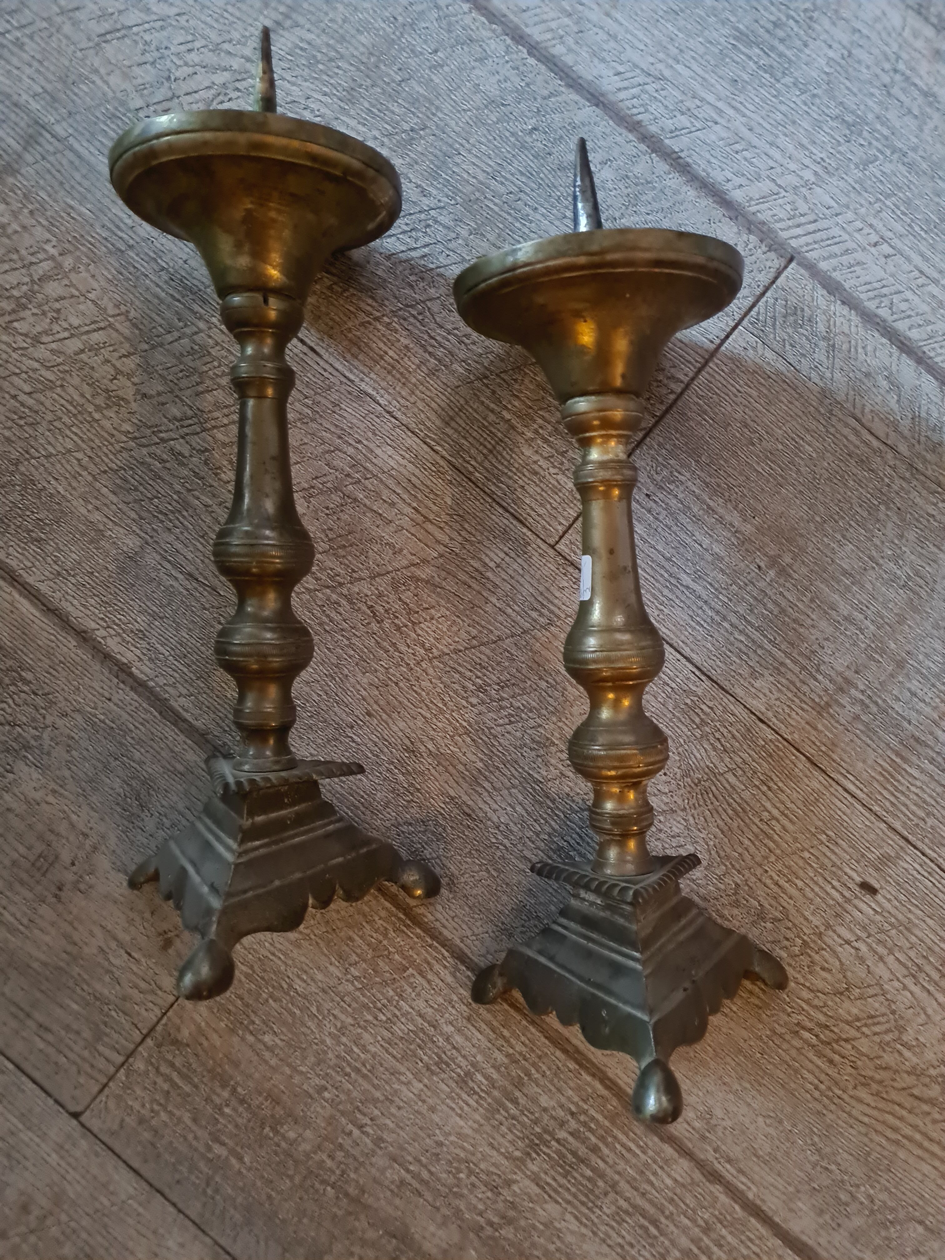 Pair of old brass candelabra