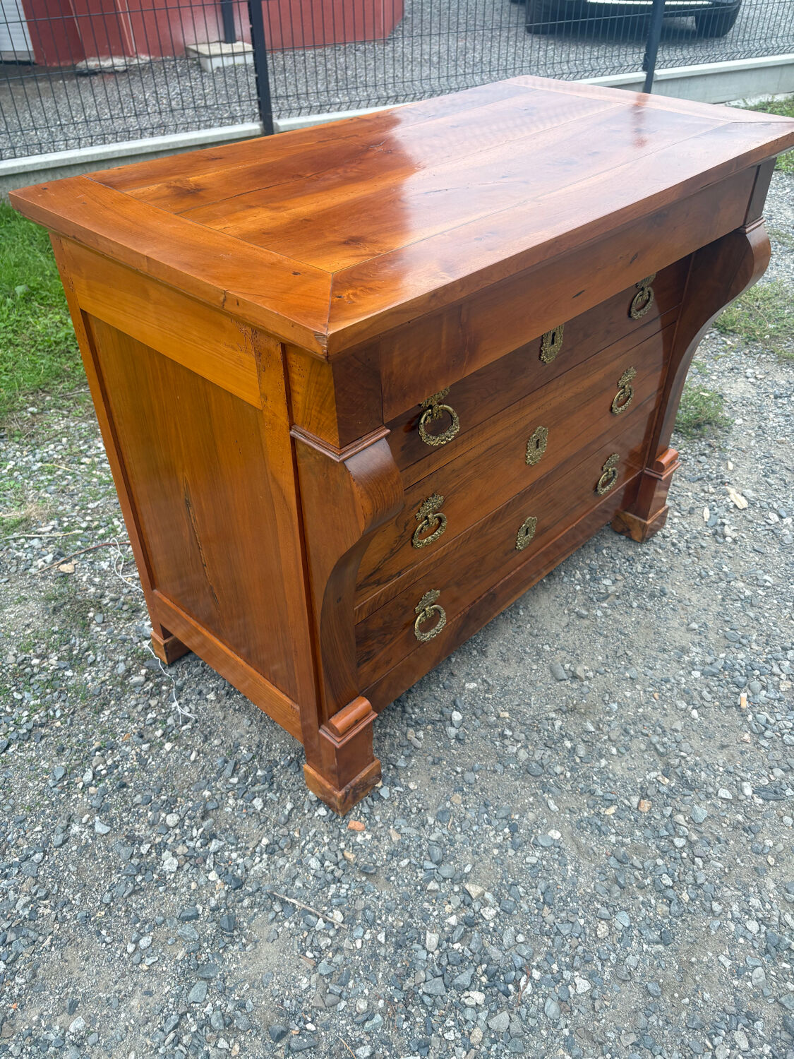 Restoration period walnut chest of drawers with a scroll handle