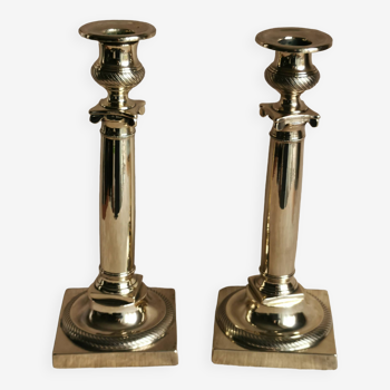 Pair of Empire candlesticks in polished brass, 19th century