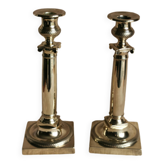 Pair of Empire candlesticks in polished brass, 19th century