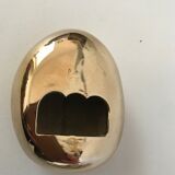 Bottle opener roller in gilded bronze by Monique Gerber