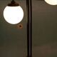 Minimalist floor lamp in glass, space age style.