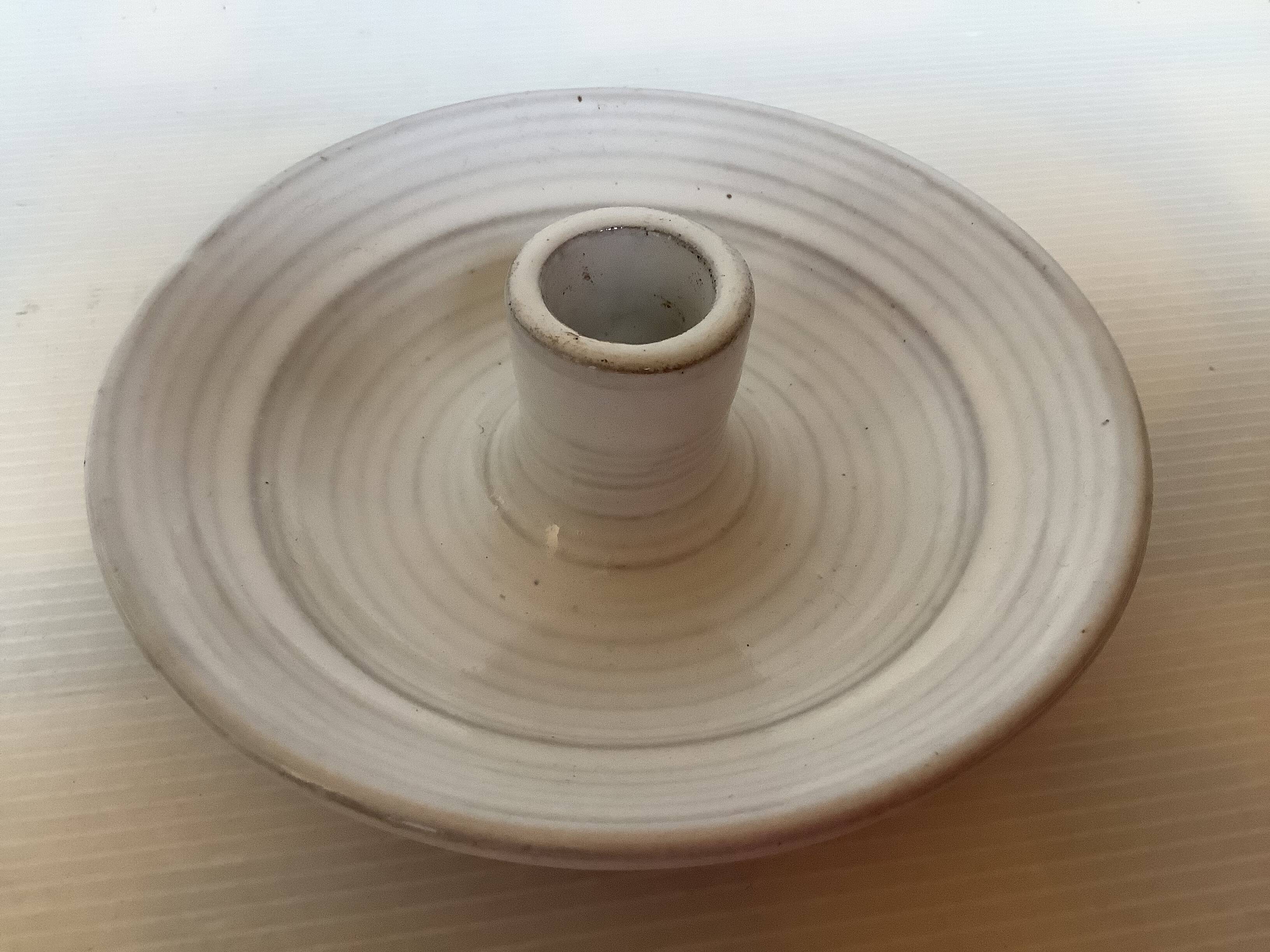 Four ceramic candle holders