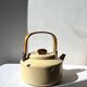 Vintage enamelled metal kettle in beige, Copco style.