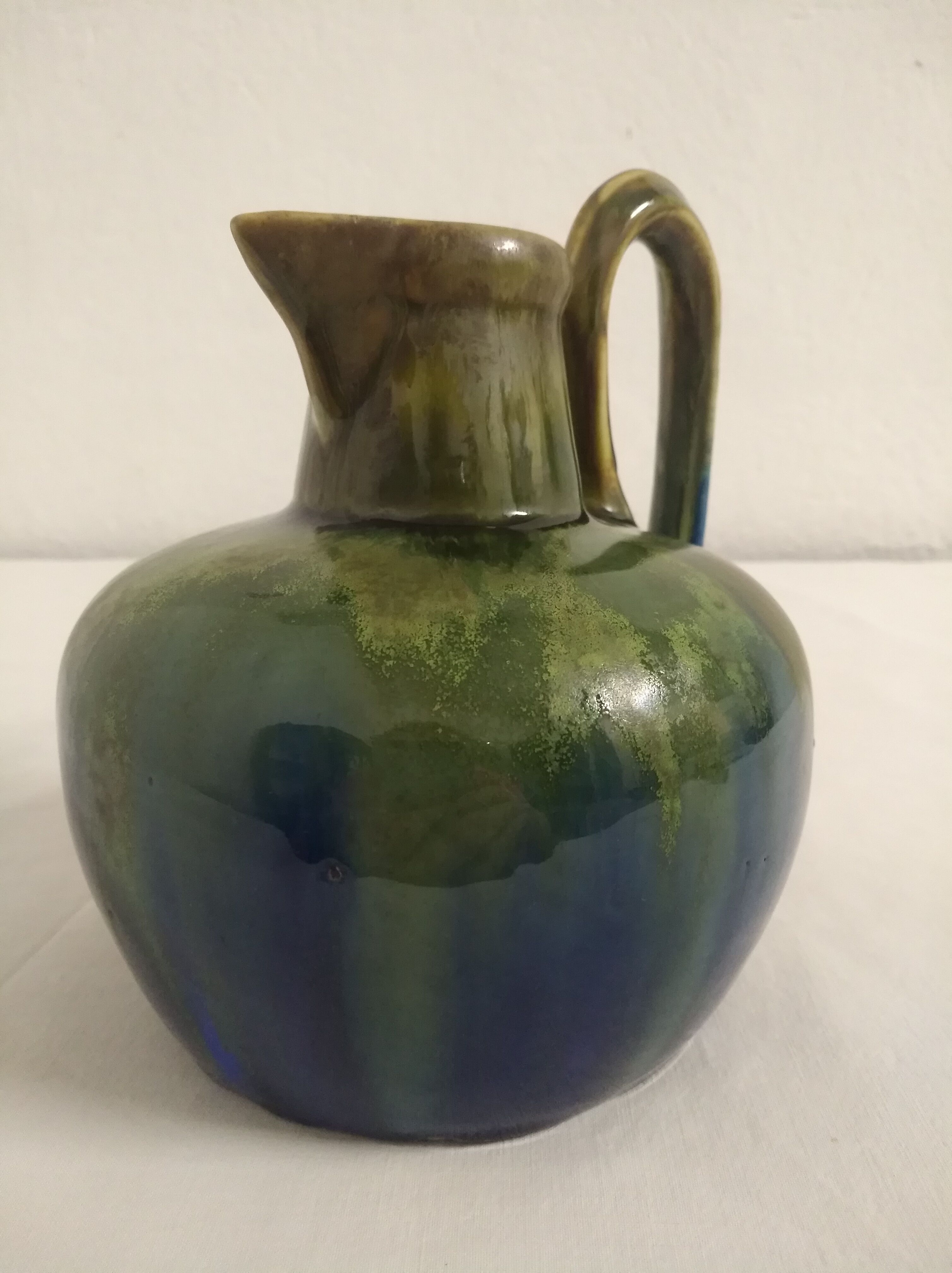 Flamed ceramic pitcher