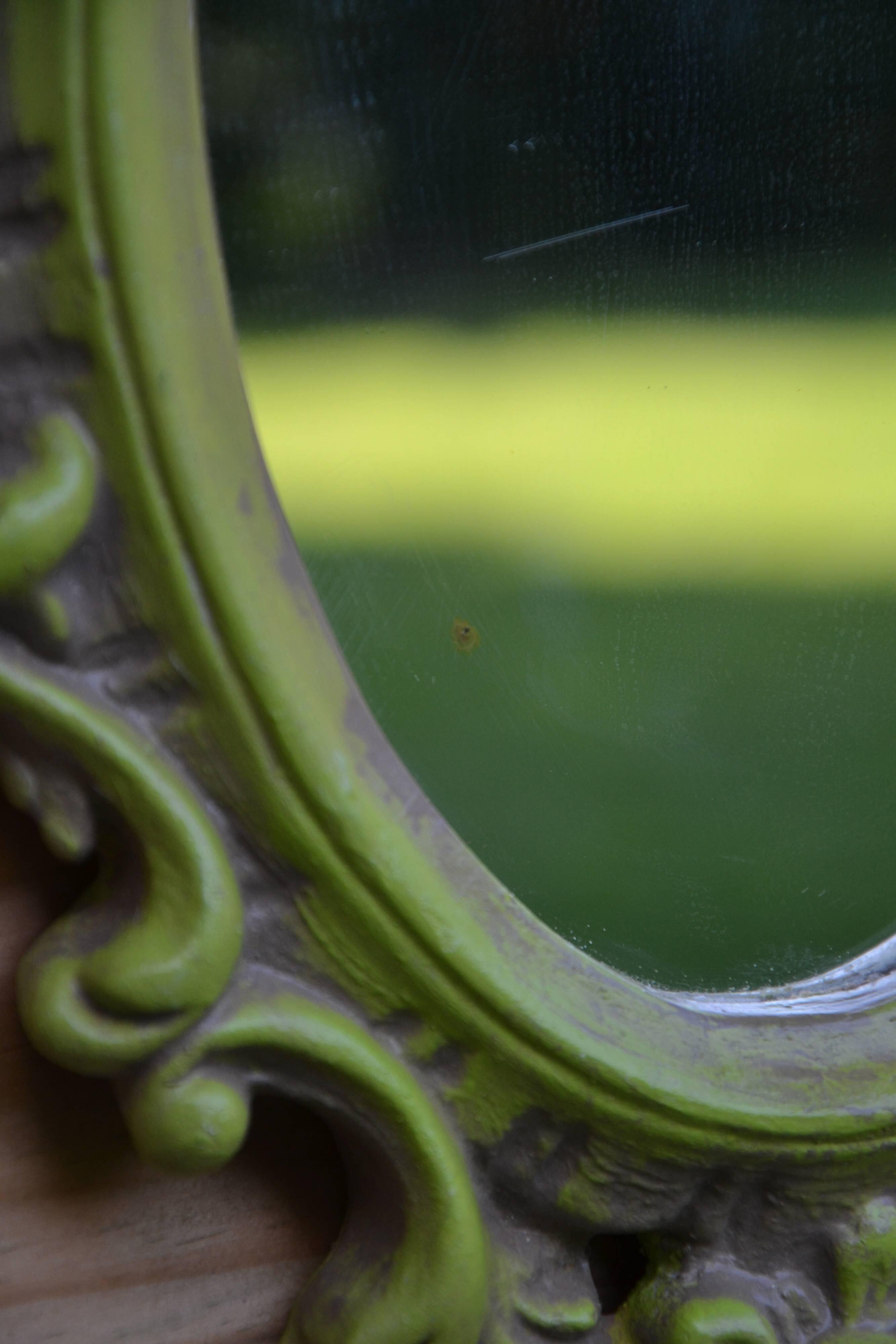 Small green wooden mirror