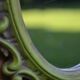 Small green wooden mirror