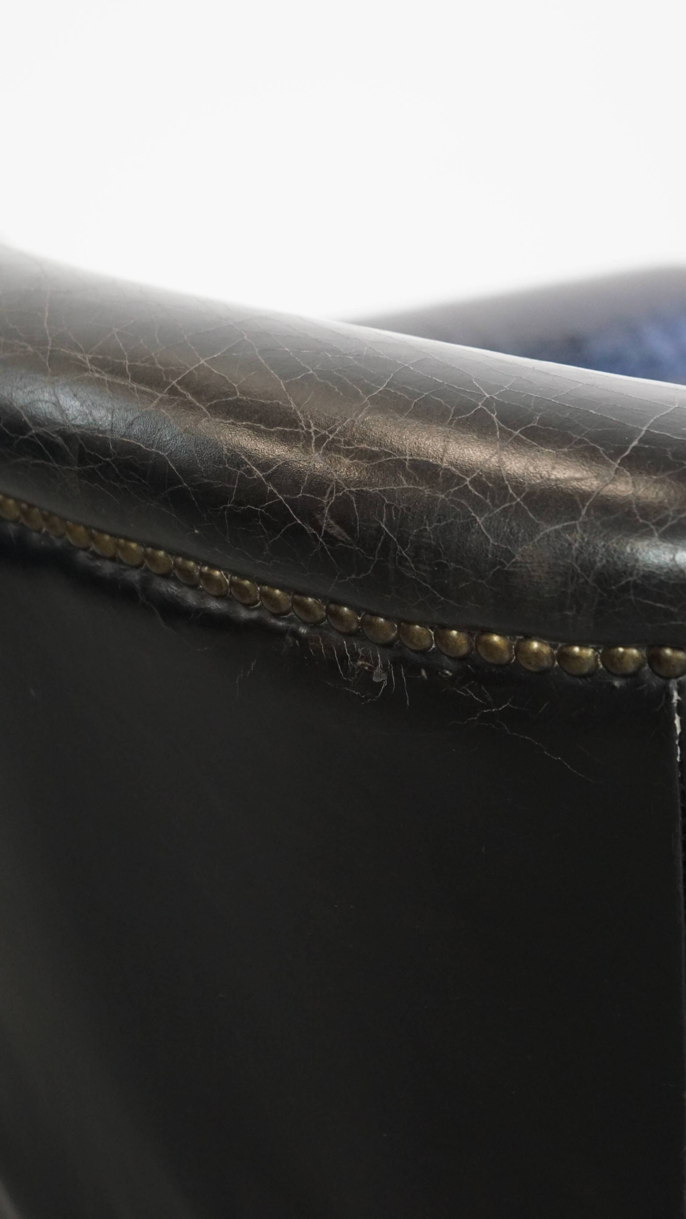 Black grained cowhide leather armchair