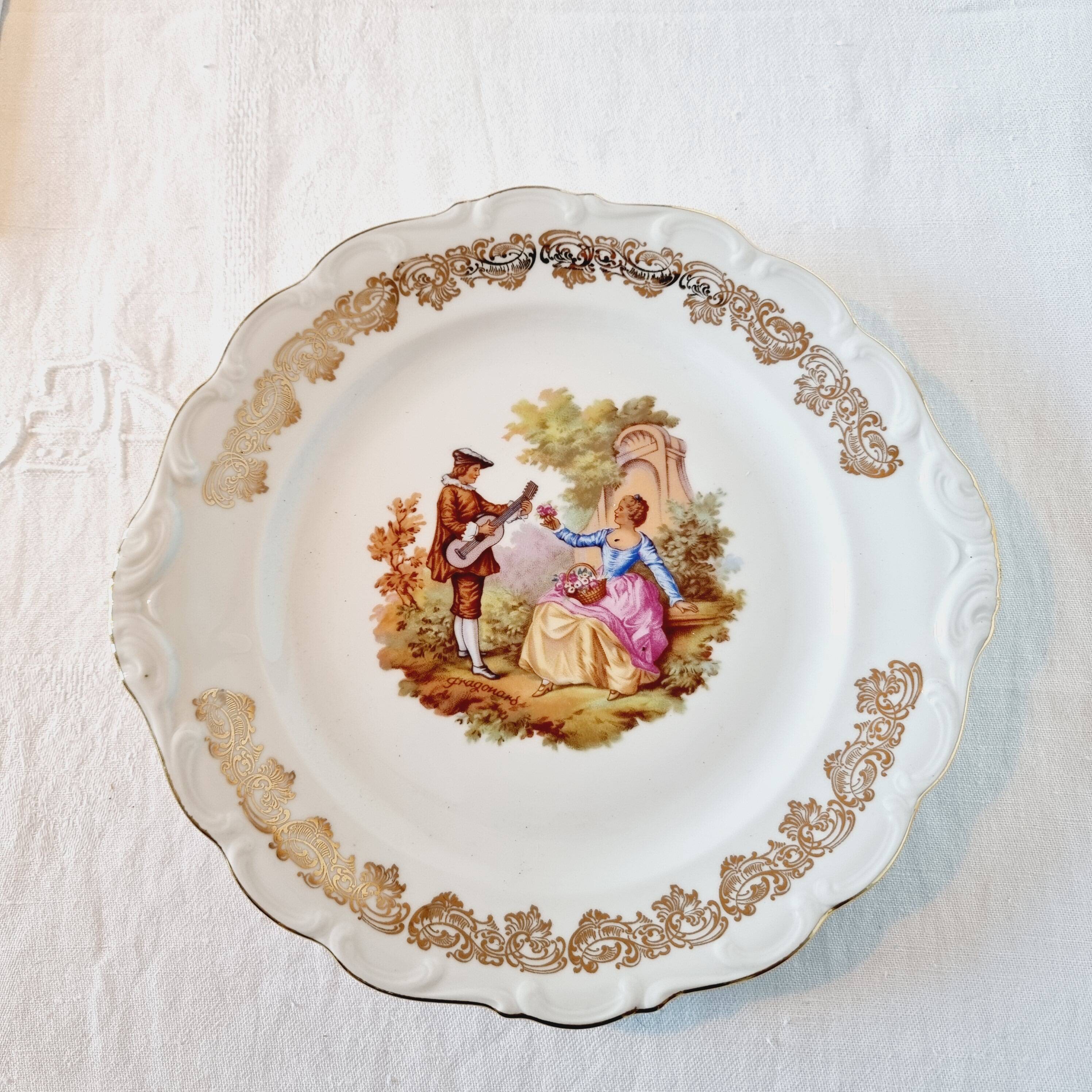 Large serving plate with romantic Frangonard scene with 24 carat gold