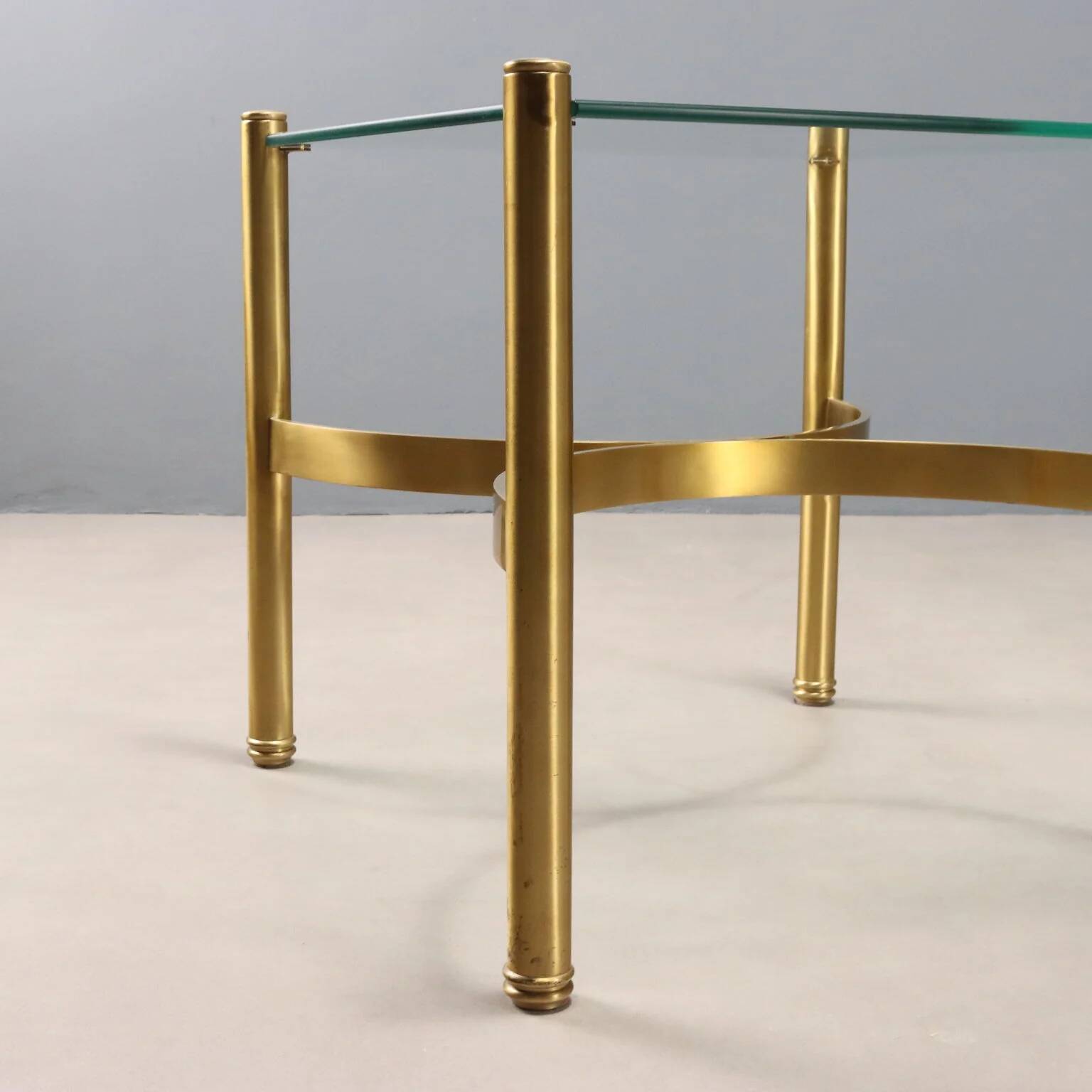 Vintage brass coffee table with glass top, Italian design from the 1970s.