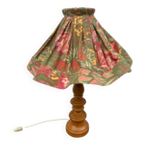 Turned wood lamp with flower shade