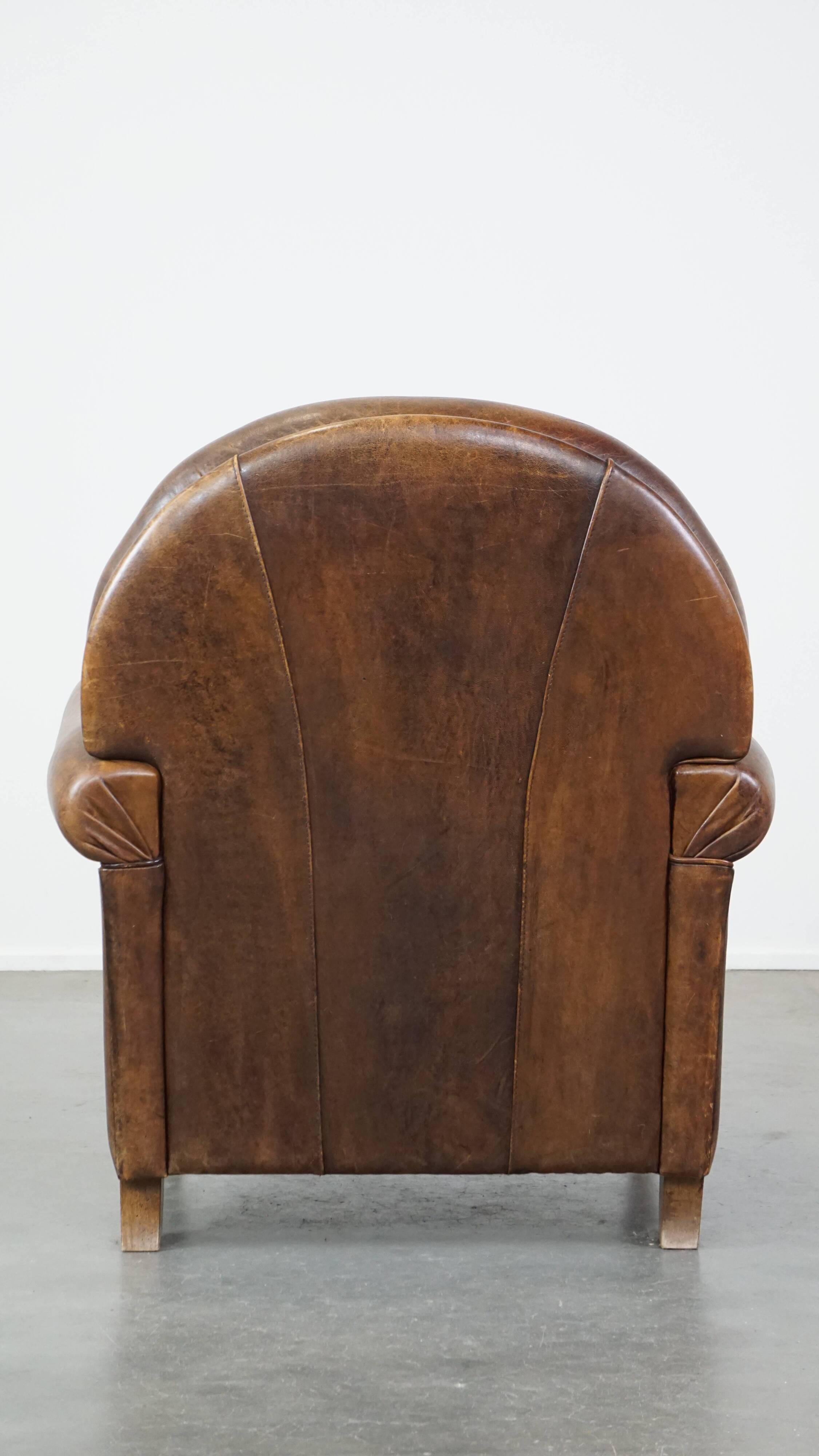 Sheep leather armchair on wheels