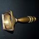 Antique baluster candlestick in bronze with hand-chiseled design.