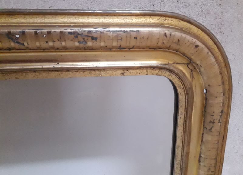 Golden Louis Philippe mirror H122xW84cm with gilded motifs.