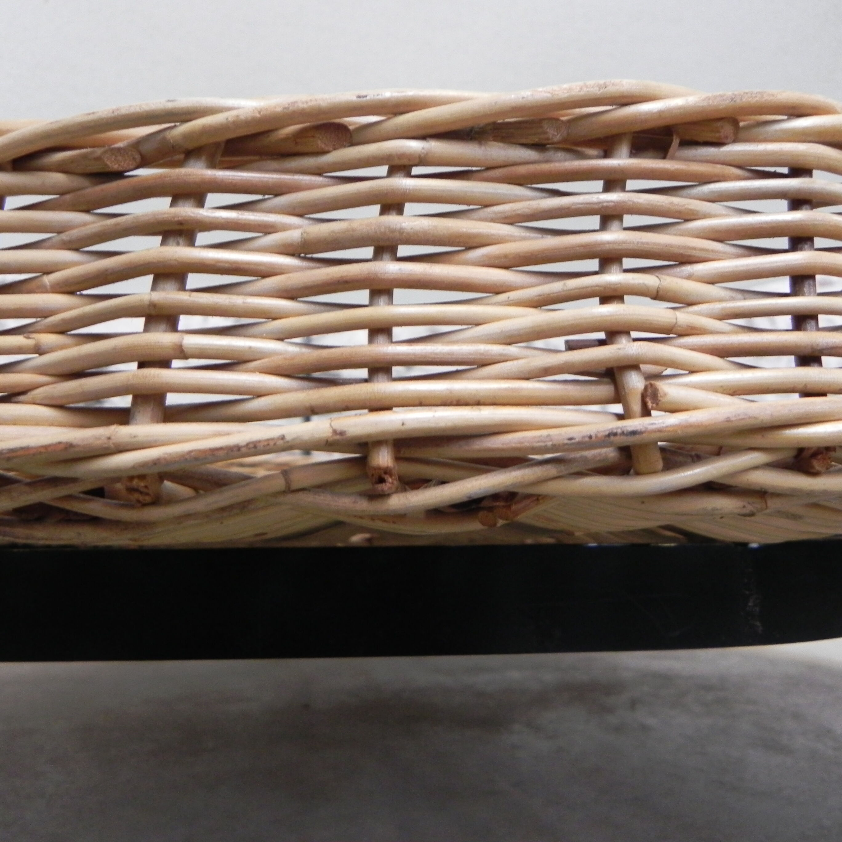 Vintage coffee table with glass top and rattan basket