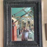 Black carved wooden mirror