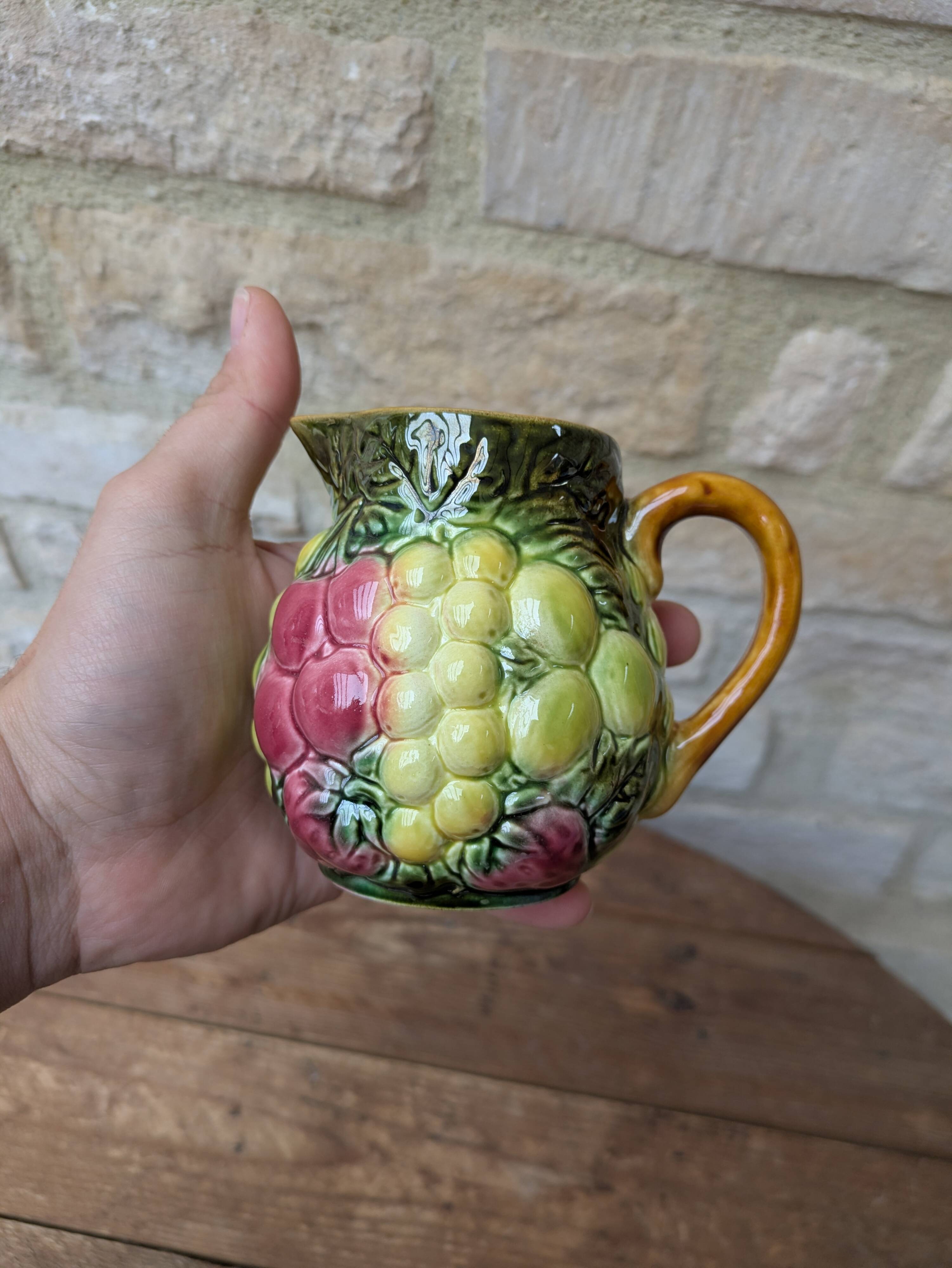 Small jug, milk pot in slipware with relief fruits Salins les Bains