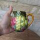 Small jug, milk pot in slipware with relief fruits Salins les Bains