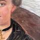 Old oil painting on canvas portrait of a woman in traditional costume