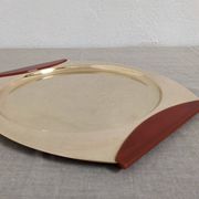 Plates and a brass and Bakelite cut by PM Italy, Italy around 1970.