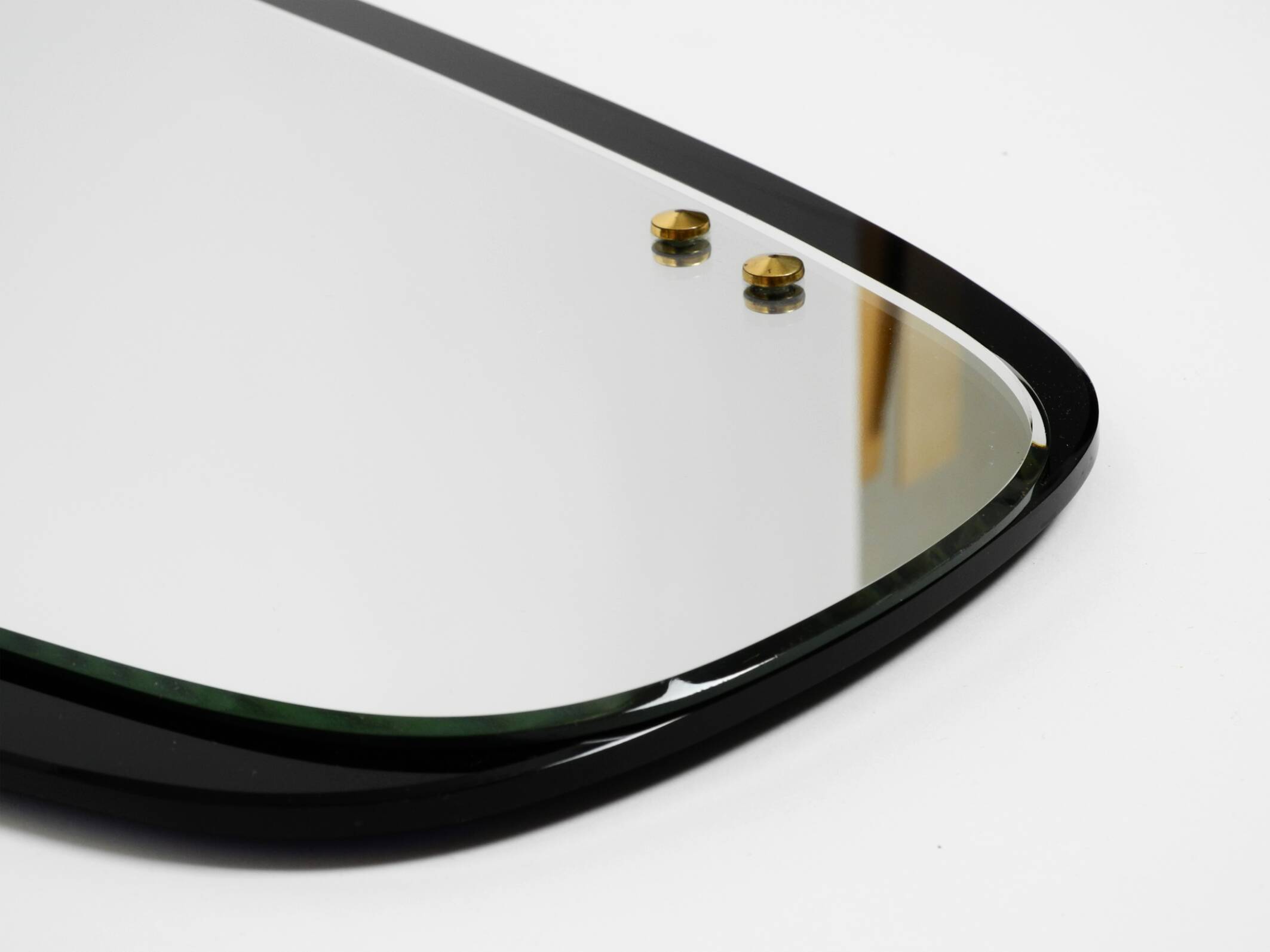 Large Mid Century wall mirror with extraordinary black glass frame