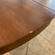 Round, extendable dining table