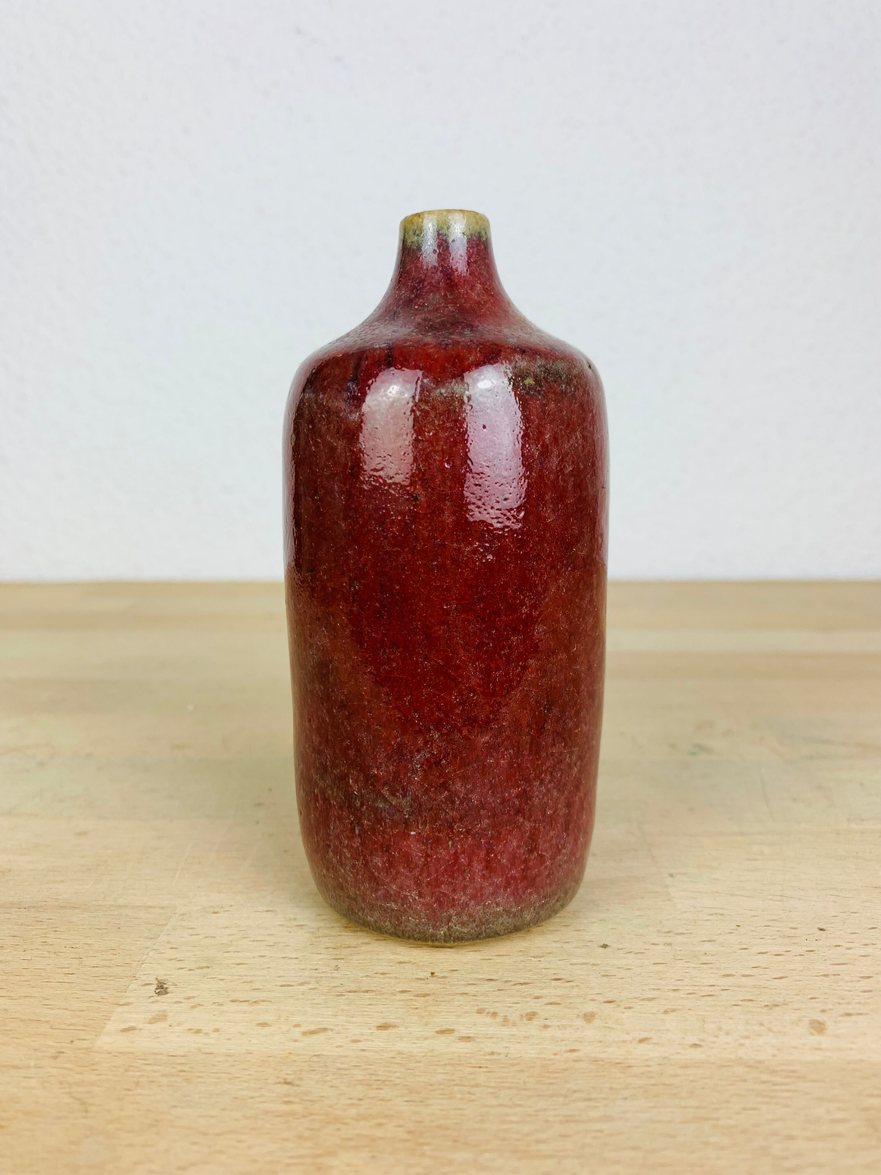 Vase red ceramic bottle signed