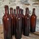 Set of 10 bottles of old Bordeaux French wine in ruby brown glass, 19th century.
