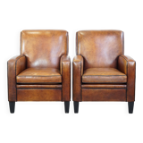 Set of 2 stylish yet comfortable armchairs made of sheepskin leather with a sleek design